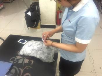 Merchandiser Checks Throughout Production - original company photograph 2